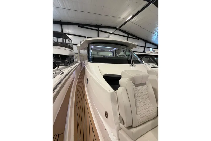 Slide: The Image of 2024 Tiara Yachts 48 LS luxury yacht interior with sleek design and modern seating. - 11