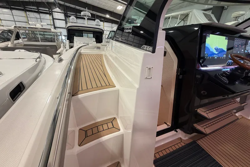 Slide: The Image of 2024 Tiara Yachts 48 LS interior with sleek design and advanced navigation system. - 17