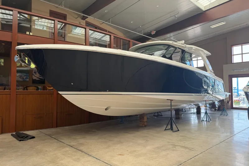 Slide: The Image of 2024 Tiara Yachts 48 LS in showroom, showcasing sleek design and modern features. - 53