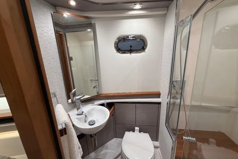 Slide: The Image of Luxurious bathroom in 2024 Tiara Yachts 48 LS, featuring modern fixtures and elegant design. - 27