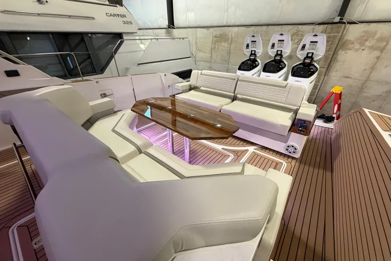 Slide: The Image of 2024 Tiara Yachts 48 LS luxury seating area with elegant wood table and modern design. - 33