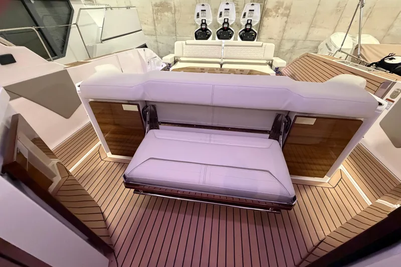 Slide: The Image of 2024 Tiara Yachts 48 LS interior with luxurious seating and sleek design. - 35