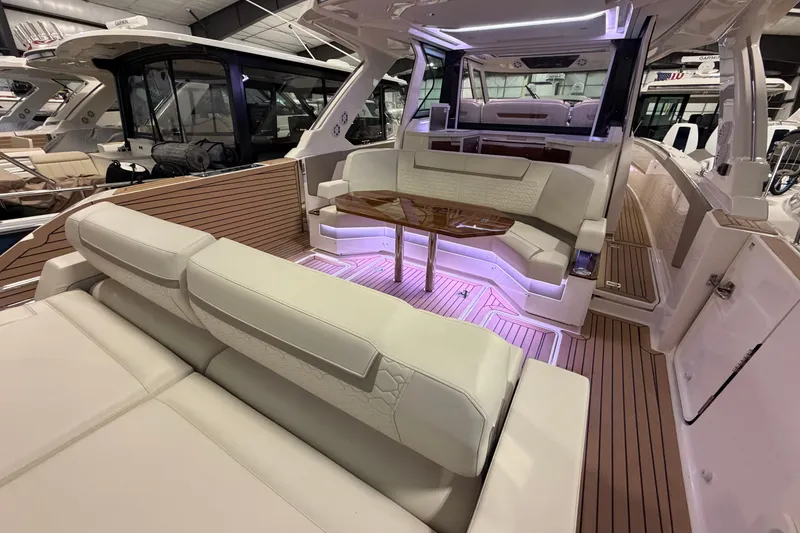 Slide: The Image of 2024 Tiara Yachts 48 LS interior with luxurious seating and ambient lighting. - 39
