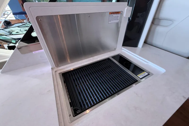 Slide: The Image of Built-in grill on 2024 Tiara Yachts 48 LS, featuring sleek countertop design. - 38