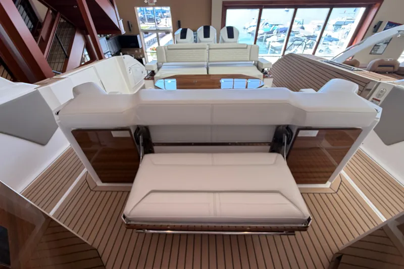 Slide: The Image of 2024 Tiara Yachts 48 LS interior with luxurious seating and elegant wood flooring. - 41