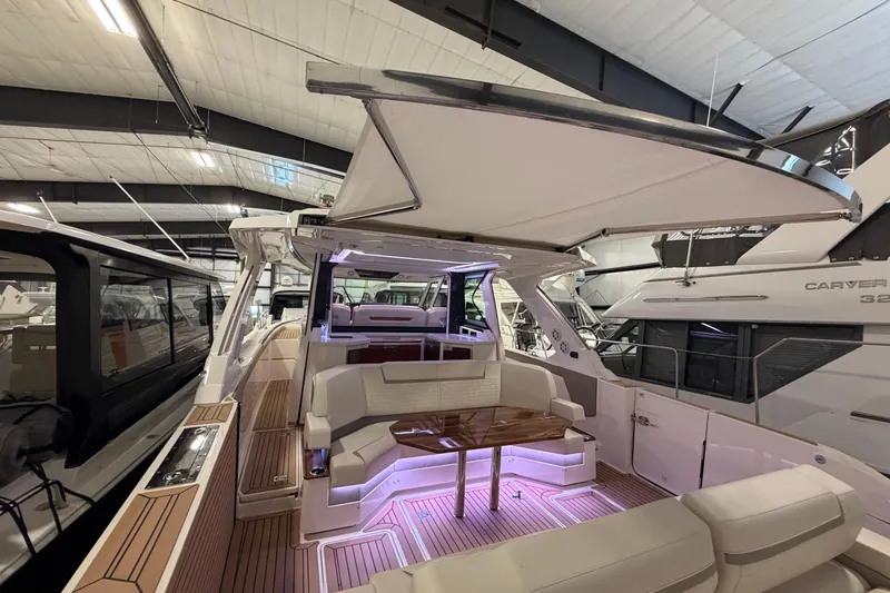 Slide: The Image of 2024 Tiara Yachts 48 LS luxury yacht interior with elegant seating and ambient lighting. - 42