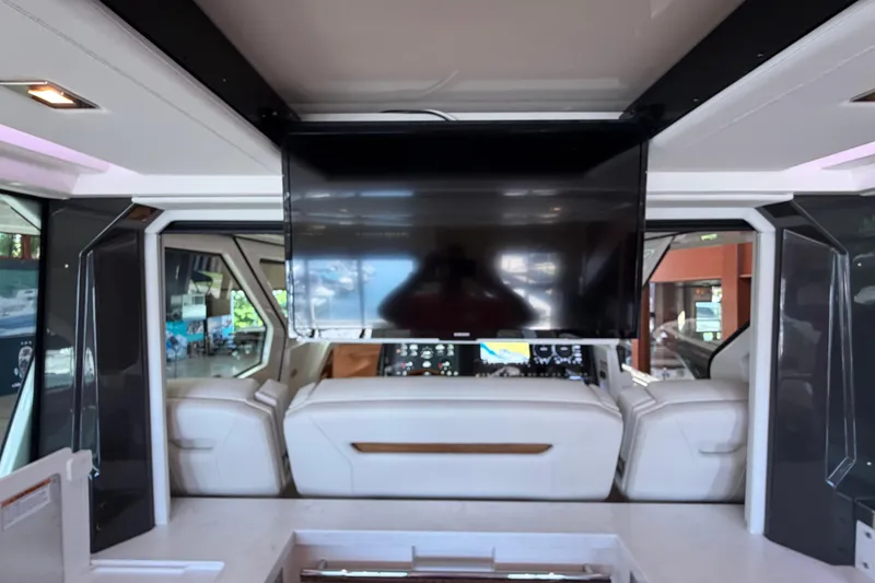Slide: The Image of Luxurious interior of 2024 Tiara Yachts 48 LS featuring a sleek entertainment setup. - 39