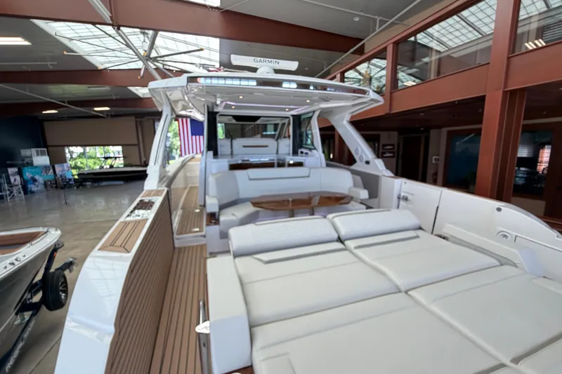 Slide: The Image of 2024 Tiara Yachts 48 LS luxury boat interior with spacious seating and modern design. - 48