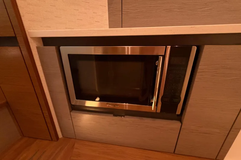 Slide: The Image of Built-in microwave in 2024 Tiara Yachts 48 LS kitchen area. - 23