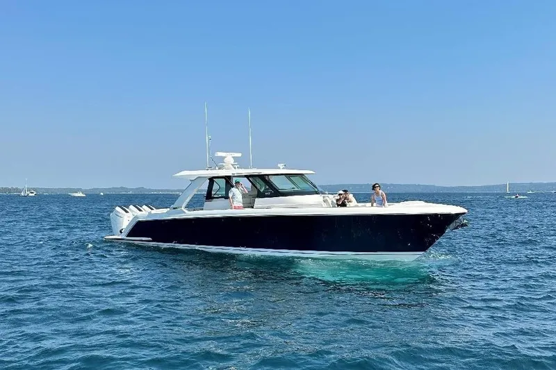 The Image of 2024 Tiara Yachts 48 LS cruising on a sunny day in open waters. - 0