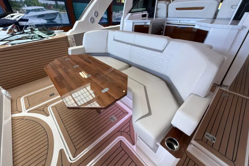 Slide: The Image of Luxurious interior of 2024 Tiara Yachts 48 LS with elegant seating and wooden table. - 46