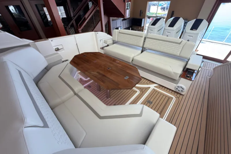 Slide: The Image of Luxurious interior of 2024 Tiara Yachts 48 LS with elegant seating and wooden table. - 42