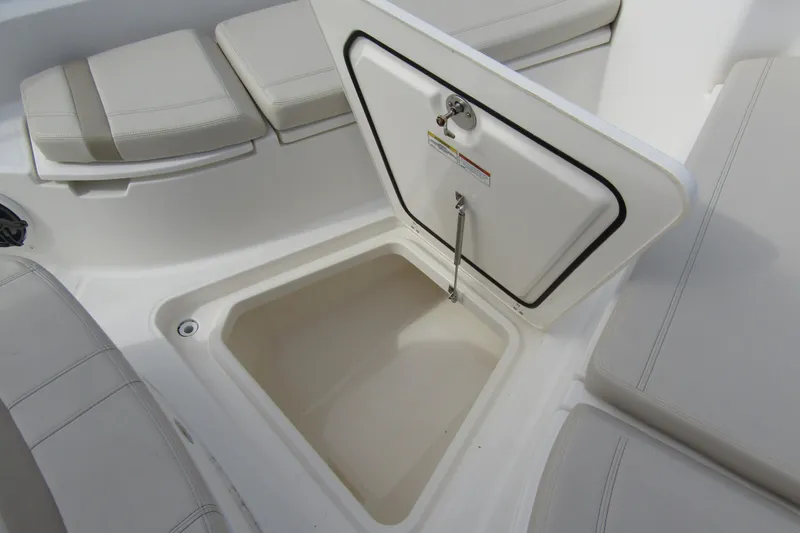 Slide: The Image of 2023 Boston Whaler 280 Dauntless storage compartment with cushioned seating. - 18