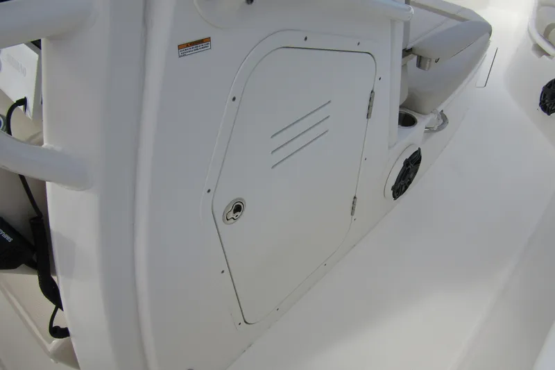 Slide: The Image of 2023 Boston Whaler 280 Dauntless interior detail with storage compartment and seating. - 19