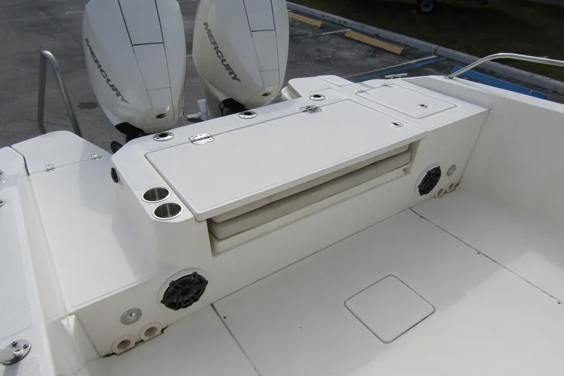 Slide: The Image of 2023 Boston Whaler 280 Dauntless boat deck with dual Mercury engines and seating area. - 28