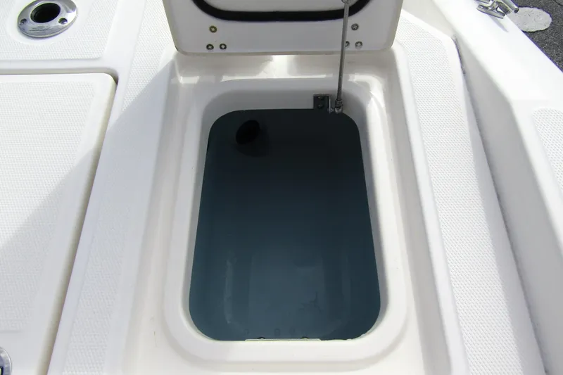 Slide: The Image of Open storage compartment on 2023 Boston Whaler 280 Dauntless boat. - 32