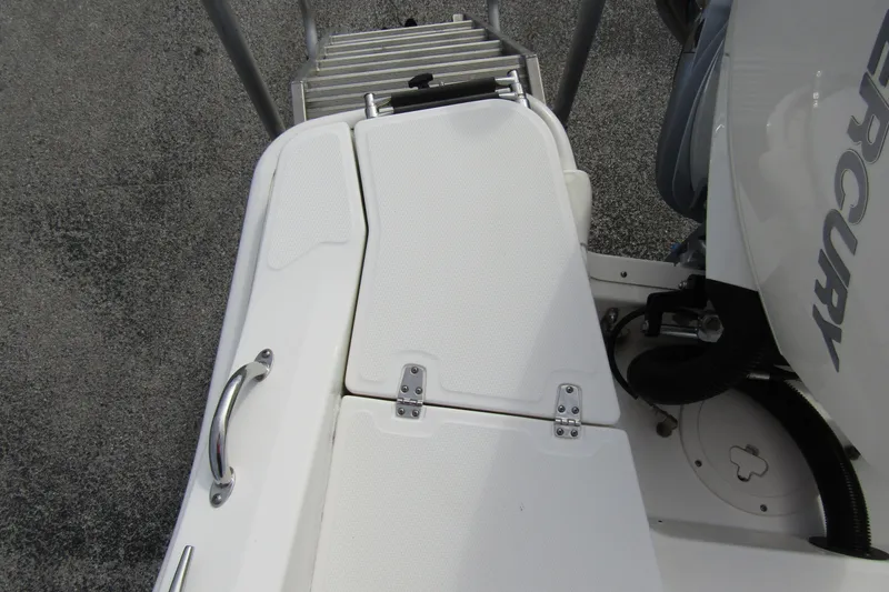 Slide: The Image of 2023 Boston Whaler 280 Dauntless boat deck with Mercury engine and swim ladder. - 33