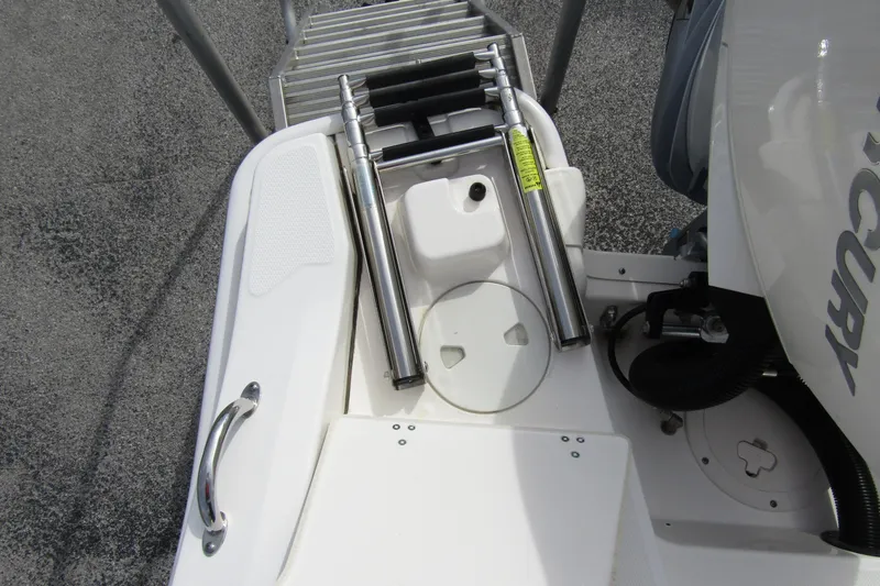 Slide: The Image of 2023 Boston Whaler 280 Dauntless boat ladder and engine detail. - 34