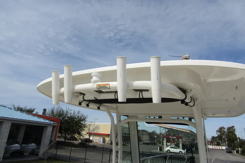 Slide: The Image of 2023 Boston Whaler 280 Dauntless boat top view with rod holders and clear sky. - 37