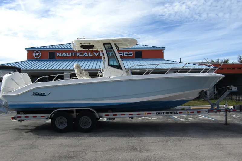 Slide: The Image of 2023 Boston Whaler 280 Dauntless boat on trailer at Nautical Ventures dealership. - 4