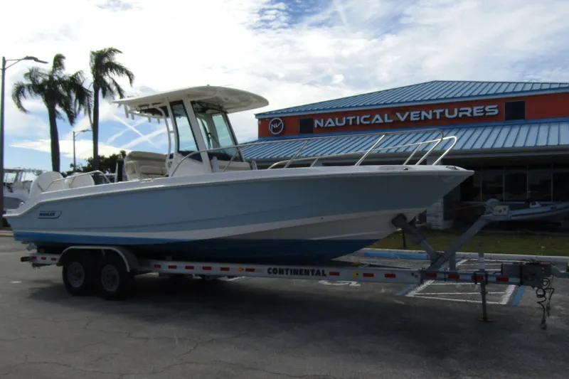 Slide: The Image of 2023 Boston Whaler 280 Dauntless boat on trailer at Nautical Ventures dealership. - 5