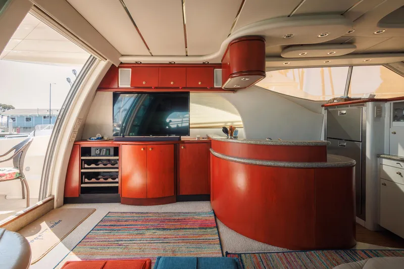 Slide: The Image of Luxurious interior of 1997 Maxum 4600 SCB yacht with modern kitchen and entertainment area. - 10