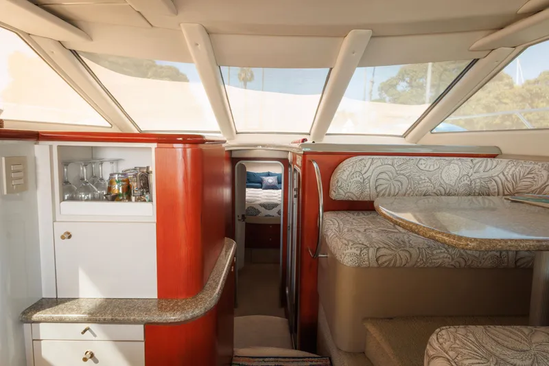 Slide: The Image of Luxurious interior of 1997 Maxum 4600 SCB yacht with elegant seating and bar area. - 15