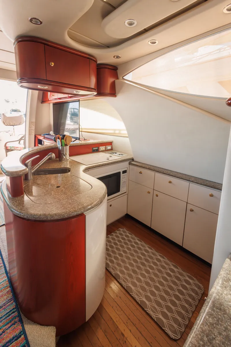 Slide: The Image of Luxurious kitchen interior of 1997 Maxum 4600 SCB yacht with modern amenities. - 20