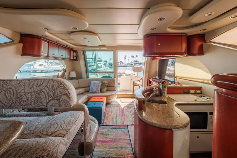 Slide: The Image of Luxurious interior of a 1997 Maxum 4600 SCB yacht with modern furnishings and vibrant decor. - 24