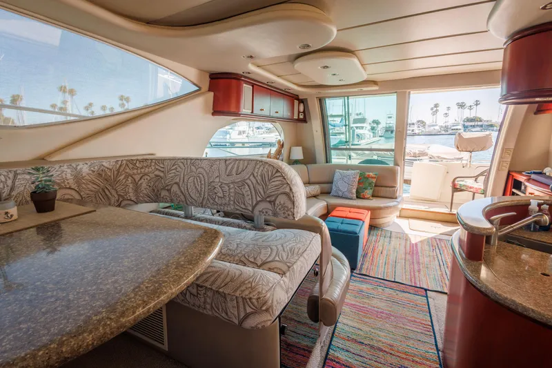 Slide: The Image of Luxurious interior of 1997 Maxum 4600 SCB yacht with elegant seating and vibrant decor. - 25
