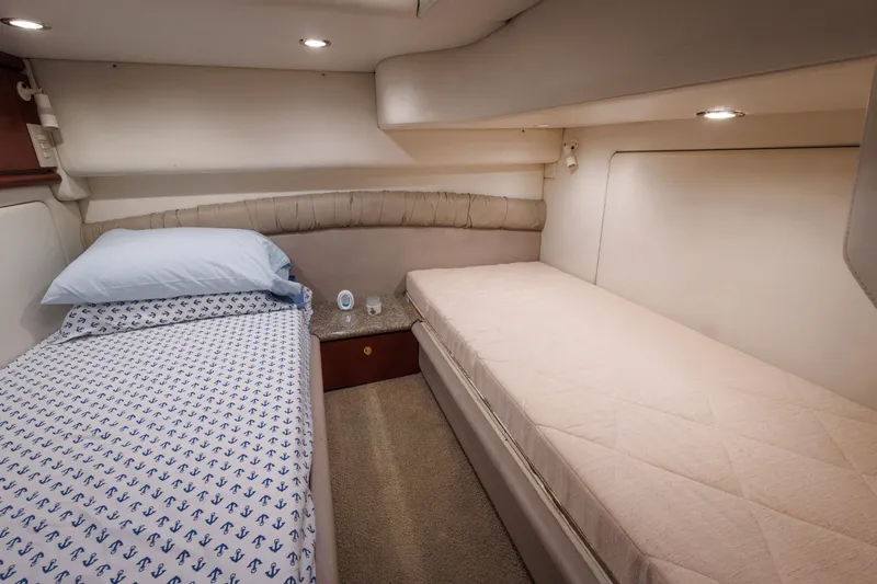 Slide: The Image of Interior cabin of 1997 Maxum 4600 SCB yacht with twin beds and modern lighting. - 28
