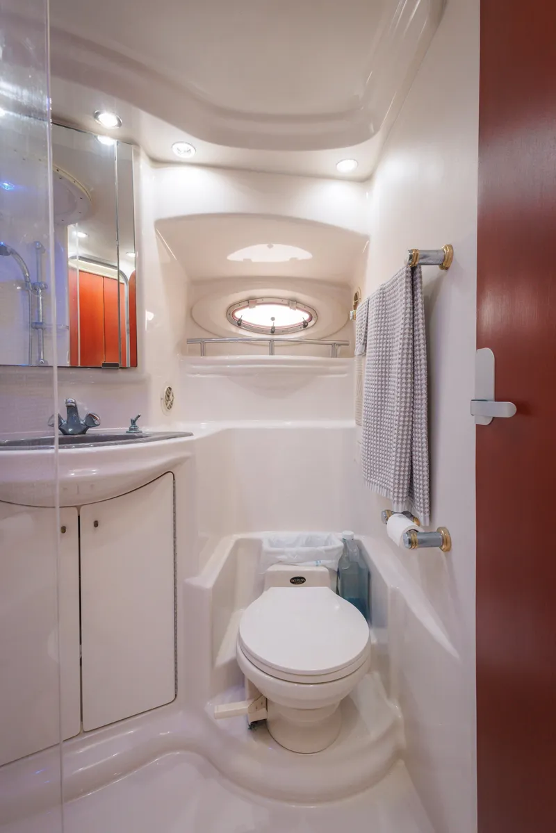Slide: The Image of 1997 Maxum 4600 SCB yacht bathroom with modern fixtures and compact design. - 32
