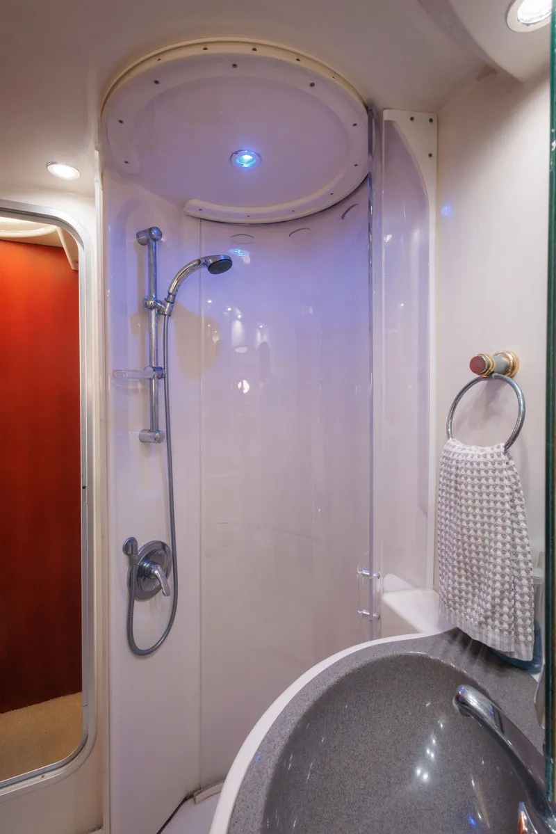 Slide: The Image of Shower area in 1997 Maxum 4600 SCB yacht with modern fixtures and lighting. - 33