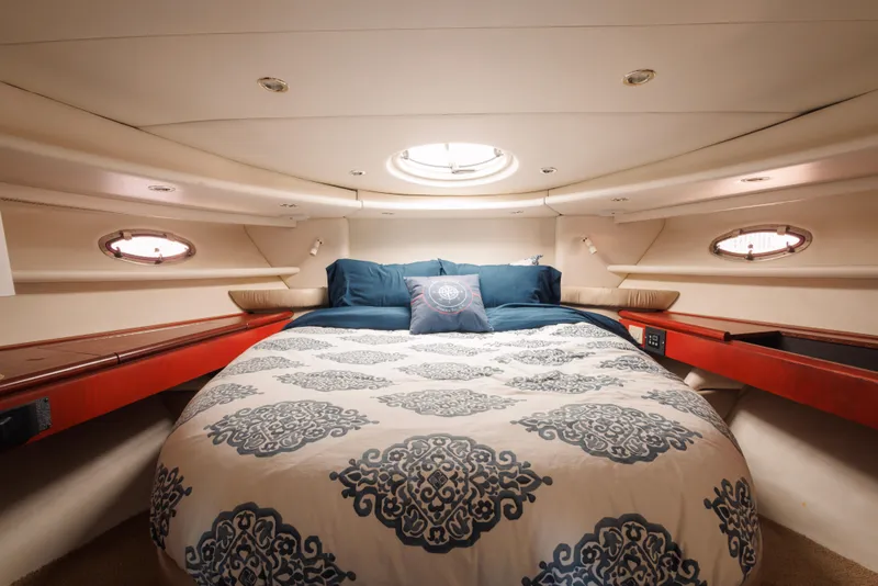 Slide: The Image of Luxurious cabin interior of 1997 Maxum 4600 SCB yacht with elegant bedding. - 35