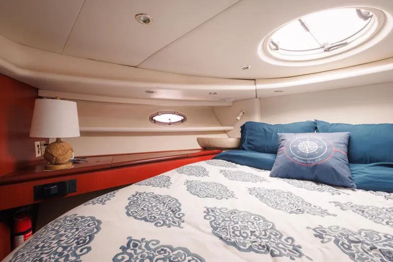 Slide: The Image of Luxurious cabin interior of 1997 Maxum 4600 SCB yacht with elegant bedding and porthole. - 36