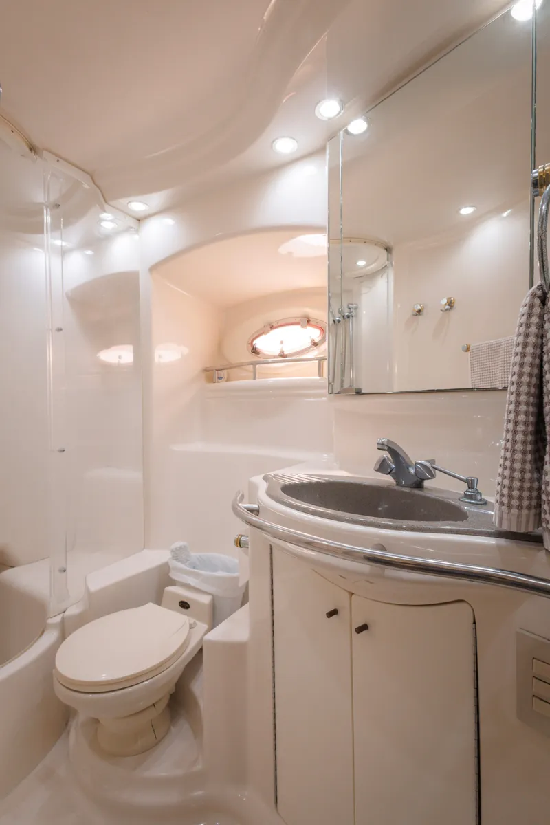 Slide: The Image of Luxurious bathroom in 1997 Maxum 4600 SCB yacht with modern fixtures and elegant design. - 38