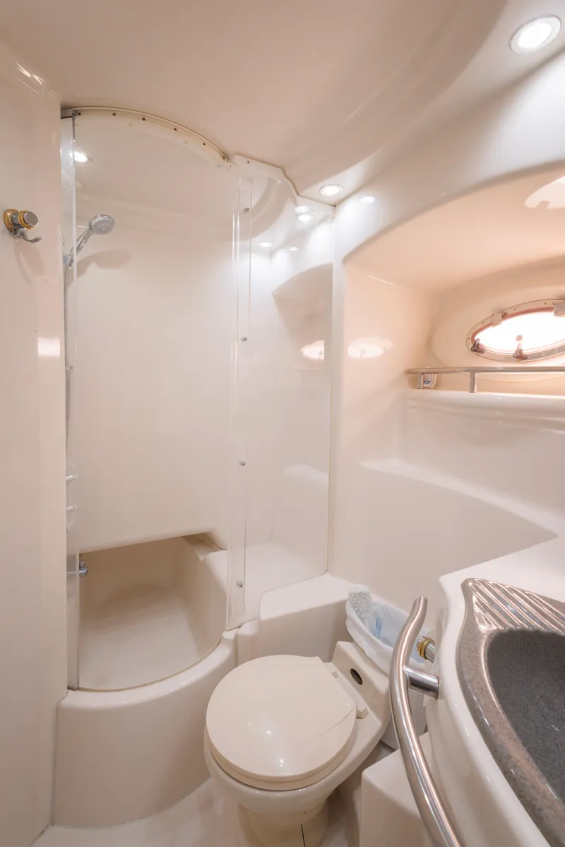 Slide: The Image of 1997 Maxum 4600 SCB yacht bathroom with shower, toilet, and sink. - 40