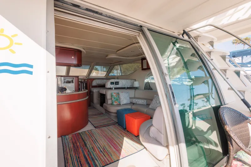 Slide: The Image of Interior of 1997 Maxum 4600 SCB yacht with cozy seating and colorful decor. - 6