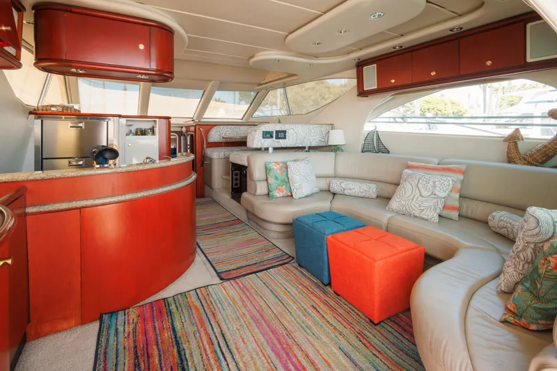 Slide: The Image of Luxurious 1997 Maxum 4600 SCB yacht interior with modern kitchen, colorful decor, and spacious seating. - 7