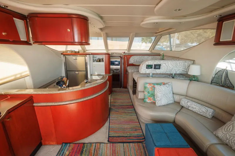 Slide: The Image of Luxurious interior of a 1997 Maxum 4600 SCB yacht with modern furnishings and vibrant decor. - 8