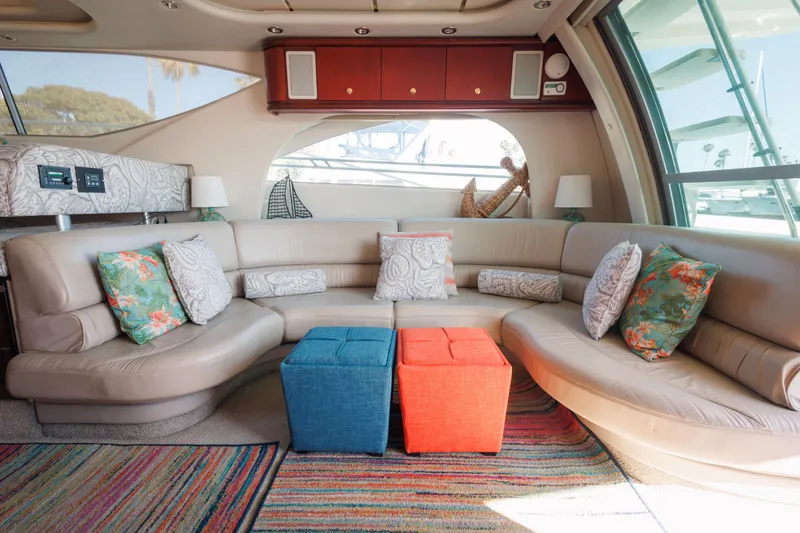 Slide: The Image of Luxurious 1997 Maxum 4600 SCB yacht interior with plush seating and colorful cushions. - 9