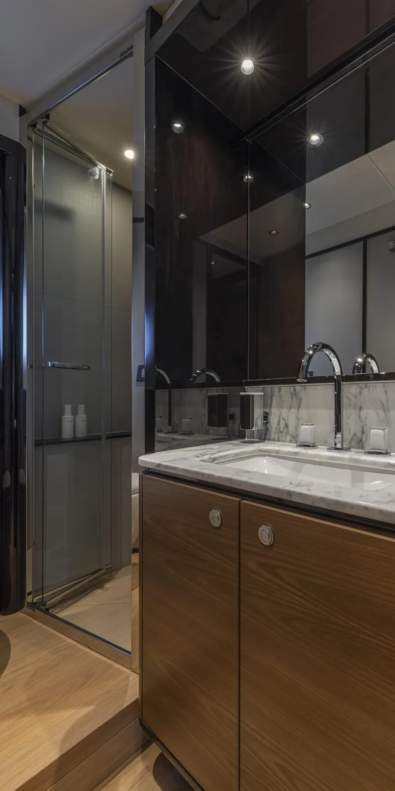 Slide: The Image of Luxurious bathroom in 2025 Absolute NAVETTA 75 yacht with modern fixtures and glass shower. - 20