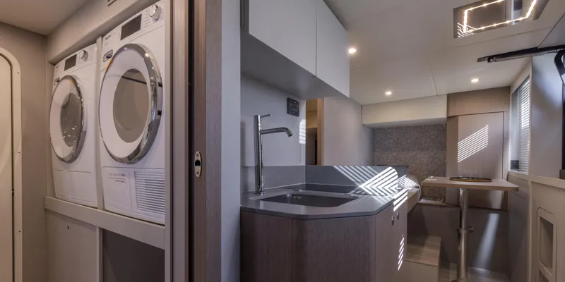 Slide: The Image of Interior of 2025 Absolute NAVETTA 75 yacht with modern kitchen and laundry area. - 36