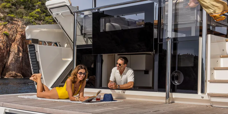 Slide: The Image of Couple relaxing on Absolute NAVETTA 75 yacht, 2025 model, enjoying luxury and leisure. - 7