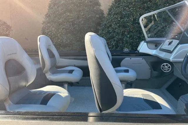 Slide: The Image of 2018 Tracker Targa 1900 boat interior with gray seating and console. - 15