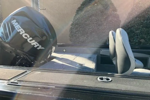 Slide: The Image of 2018 Tracker Targa 1900 boat with Mercury engine, interior view, sunlight streaming in. - 16