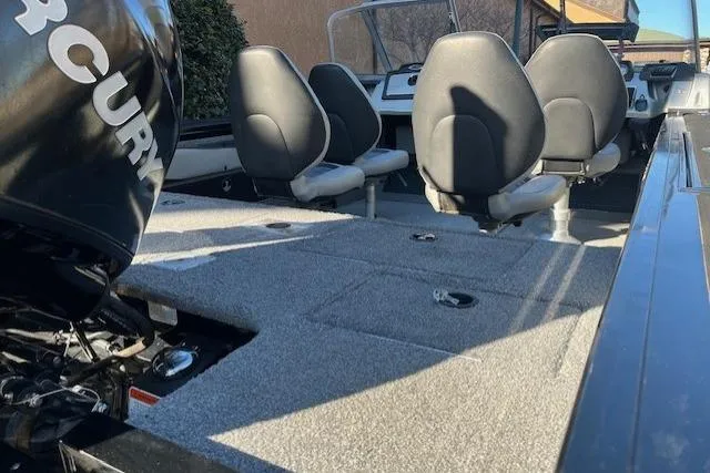 Slide: The Image of 2018 Tracker Targa 1900 boat interior with seating and Mercury engine. - 20