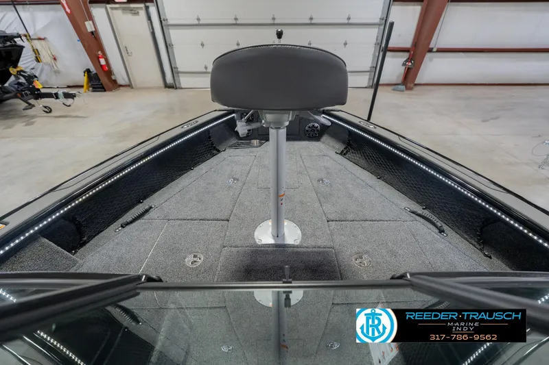 Slide: The Image of 2026 Lund 1975 Pro-V Sport boat interior with seating and storage compartments. - 19