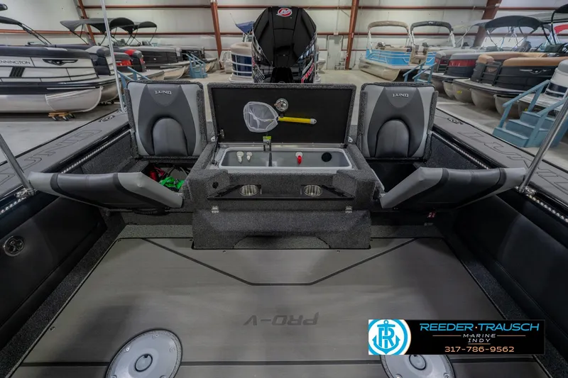 Slide: The Image of 2026 Lund 1975 Pro-V Sport boat interior with seating and storage compartments. - 25