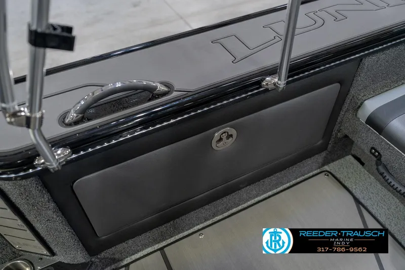 Slide: The Image of 2026 Lund 1975 Pro-V Sport boat interior with storage compartment and handle. - 26